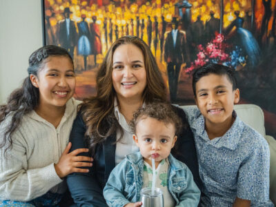 Lupe Gomez seated with her family in Perris.